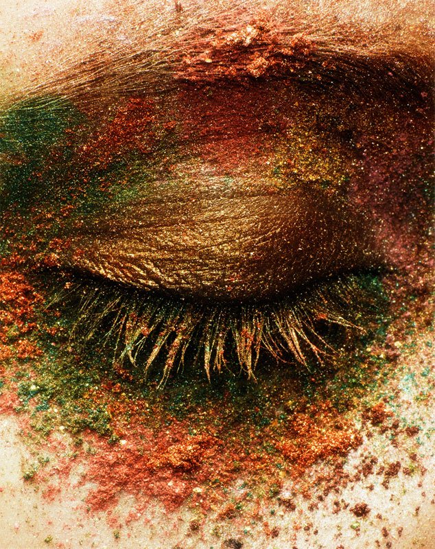 Extreme close-up beauty shot, shimmering metallic eyeshadow