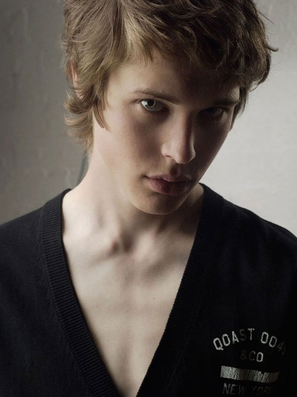 Men's close-up campaign portrait in a cardigan