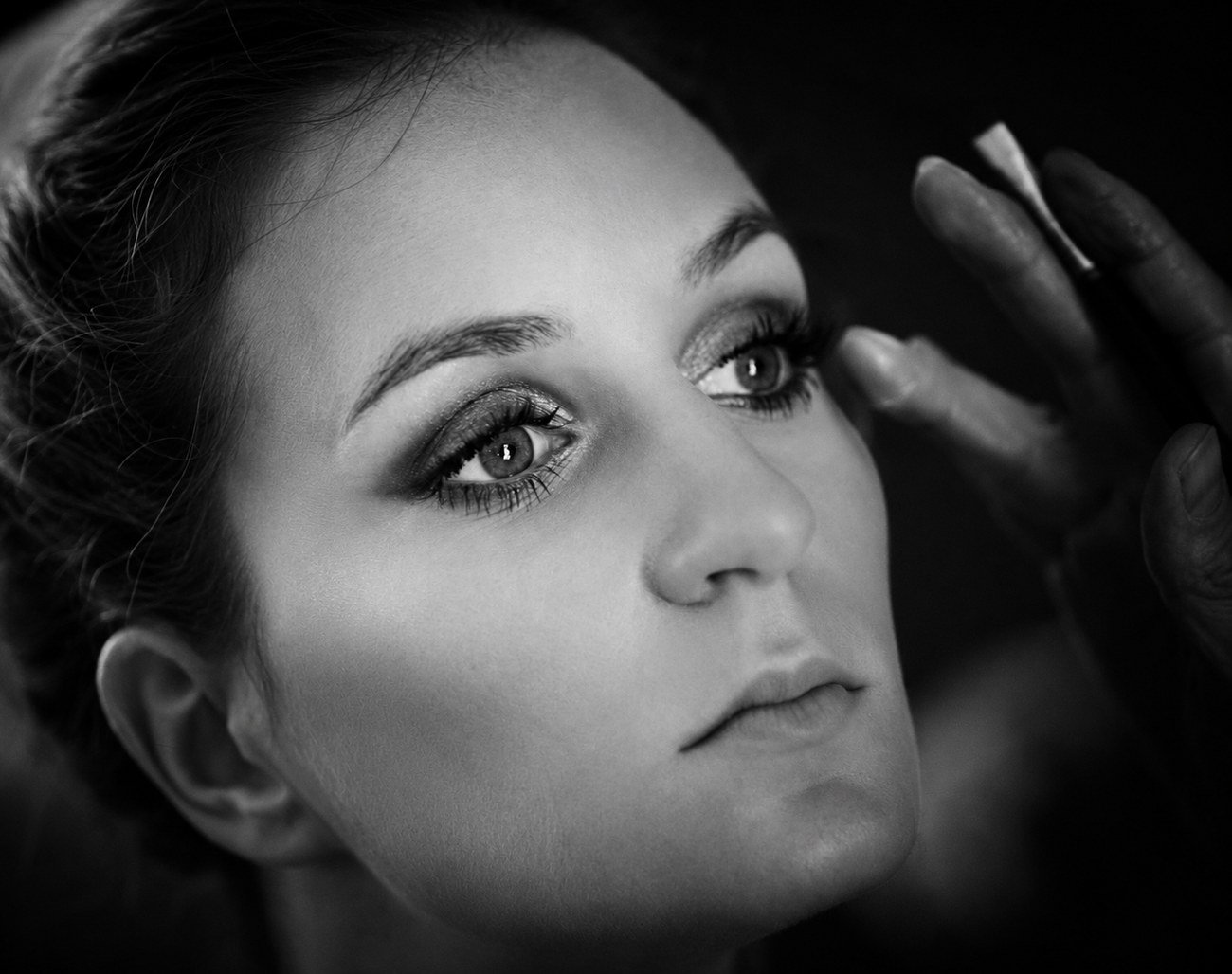 Close-up of bride's eye during makeup application